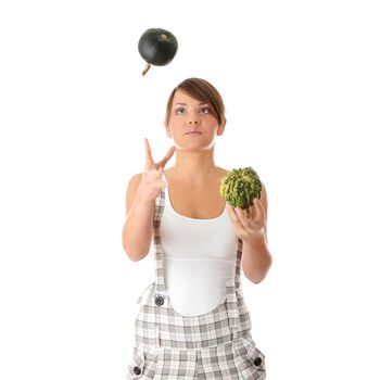 Teen woman juggle two smal pumpkins