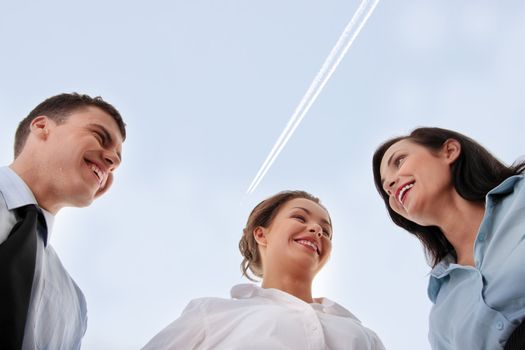 Business team, against blue sky