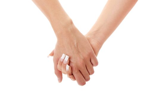 Two woman holding their hands isolated on white background