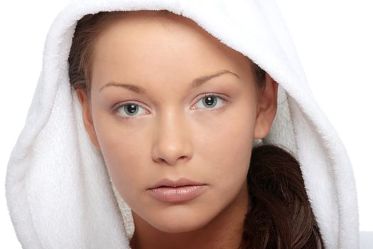 Beautiful young caucasian woman in bathrobe after bath calm portrait. Isolated