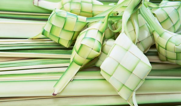 Ketupat: South East Asian rice cakes bundle, often prepared for festivities and celebratory occasions.                