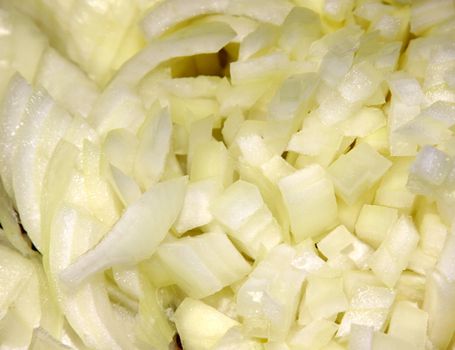 A close-up of a sliced large yellow onion.
