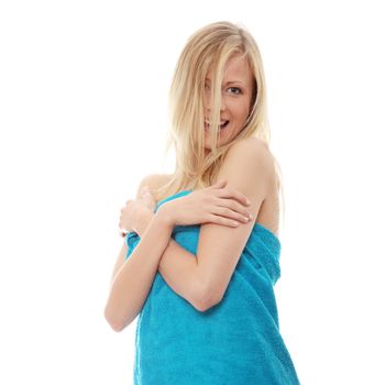 Young topless caucasian woman with blue towel isolated on white background