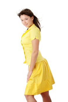 Young beautiful woman in yellow summer dress and yellow shirt, isolated on white background