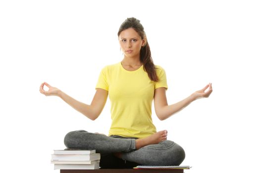 Happy student gir meditating, isolated on white