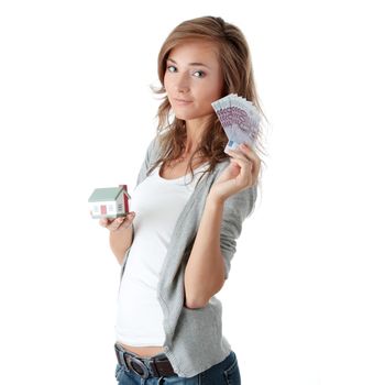 Beautiful young woman holding euros bills and house model over white