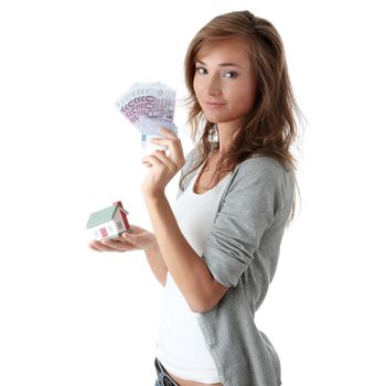 Beautiful young woman holding euros bills and house model over white - real estate loan concept