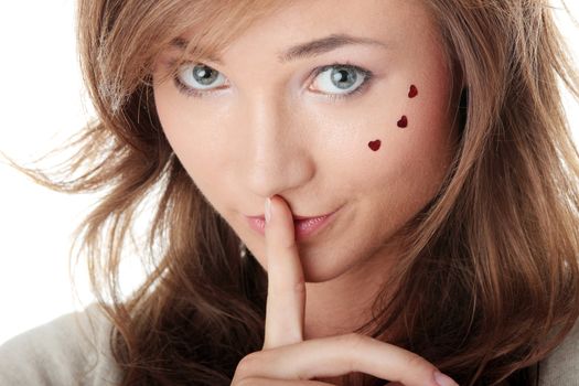 Young Woman Gesturing for Quiet or Shushing Isolated