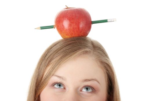 Beautiful student woman have one apple with pencil on her head - learning concept