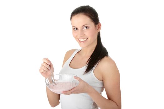 Female eating yogurt isolated on white background