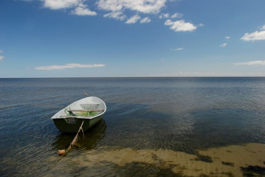 Plastic boat on the serene Baltic sea