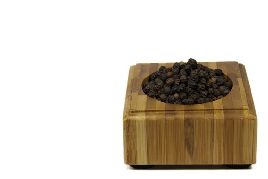 pepper in a wooden casing