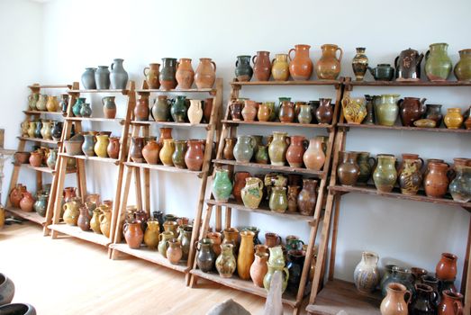Many colored jugs added to the shelfs for selling