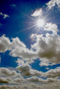 Awesome sky with many clouds and sun lightening through them.