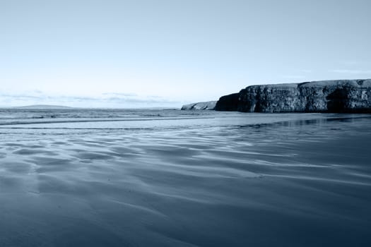 a view of the beach cliffs in ballybunion co kerry ireland on a cold winters day