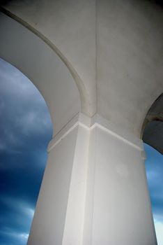 Column between the two arches in evening darkness