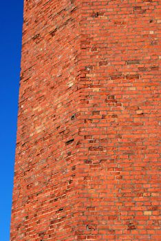 Fragment of old squared red brick wall