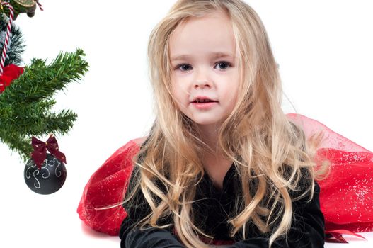 Beautiful baby girl dressed up for Christmas isolated in white