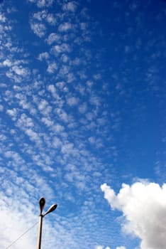 Street lights and the sky clouds above them