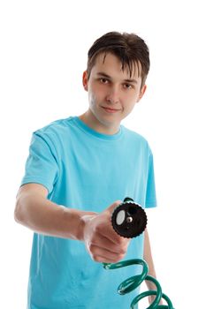 A boy holding a garden hose with selective trigger nozzle attachment and pointing it straight ahead.  White background.