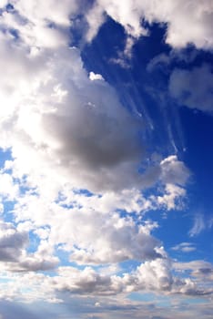 White cumulus formations in the sky blue