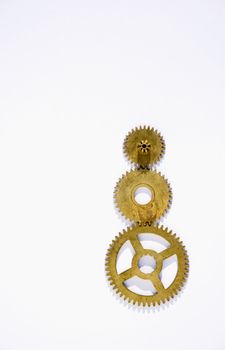 Three clock circles made of brass in a white background