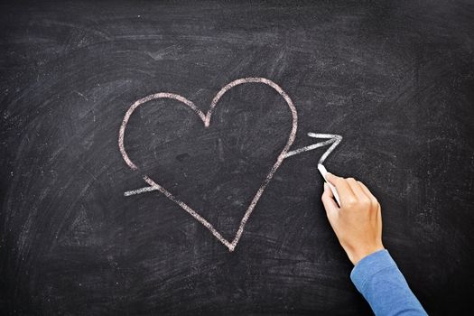 Blackboard heart - love concept. Hand drawing heart with chalk on chalkboard.