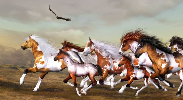 a wild herd of horses galloping across the land