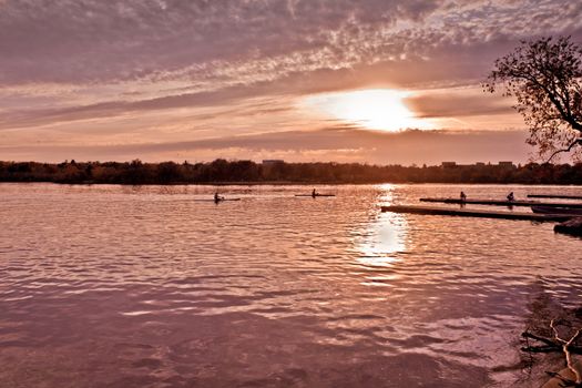 Beautiful sunset over lake Wascana with reflection of the sun on the water