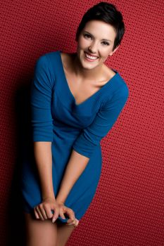 Smiling woman wearing blue dress