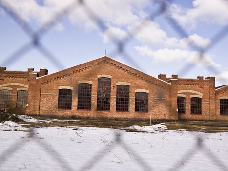 Brick Wall building behind a fence