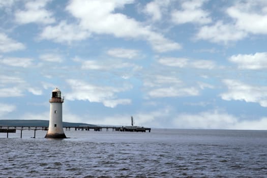 a lighthouse on the mouth of the river shannon