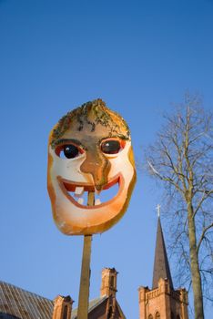 Spring feast Mardi Gras mask on sky background