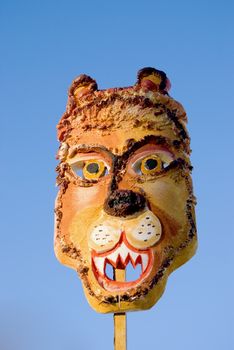 Spring feast Mardi Gras lion mask on sky background