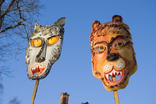 Spring feast two Mardi Gras masks on blue sky background