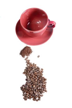 empty coffe cup with ground coffee and coffee beans - so coffee in the making