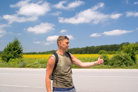 Man stops a cars on a roadside