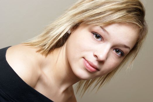 A casual portrait of an attractive young woman with a modern hairstyle.