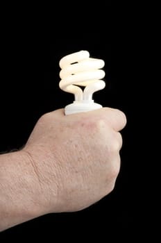 Man's hand holding a green power flourescent light