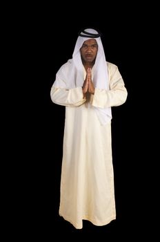 Arabian african man in traditional dress over a black background