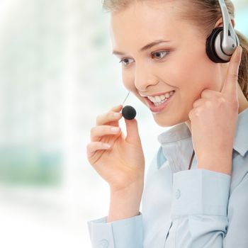 Call center woman with headset. Beautiful smiling caucasian woman