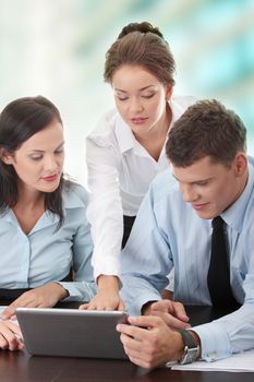 Interracial business team working at laptop in a office