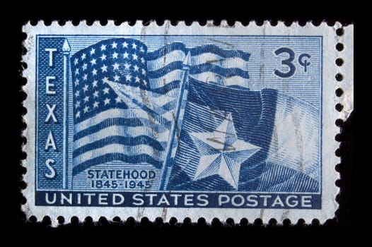 UNITED STATES- CIRCA 1945: Depicting US flag and Texas flag, with inscription " Statehood 1845-1945", color blue, face value 3 cents, circa 1945