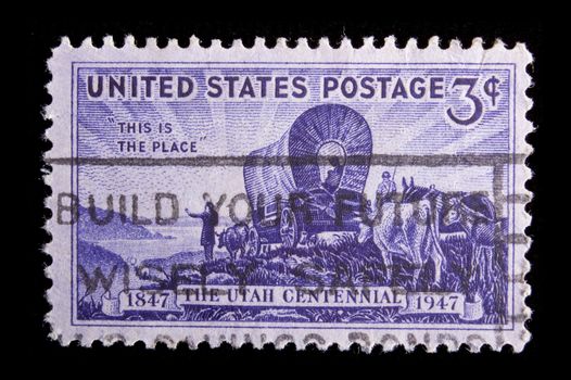 UNITED STATES - CIRCA 1947: Image depicting a wagon train, inscripted "The Utah Centennial 1847-1947" and "This is the place", face value 3 cents, circa 1947