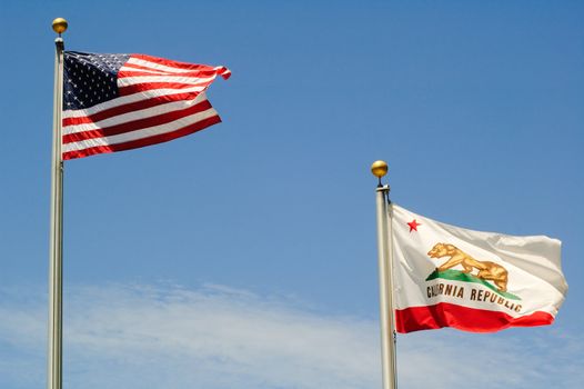 THe US Stars & Stripes, old glory and the California Republic flags waving in a stiff breeze