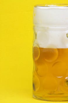 bavarian beer mug detail in yellow background
