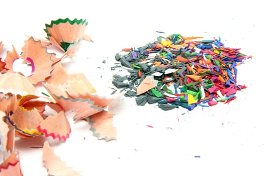 multicolor pencils wood shavings on white background