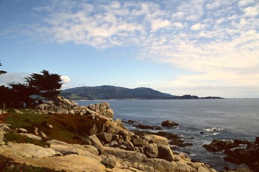 The 17 Mile Drive is a scenic road through Pacific Grove and Pebble Beach, California, United States, much of which hugs the Pacific coastline and passes famous golf courses and mansions.