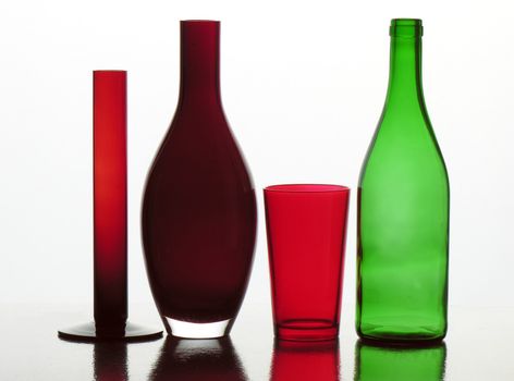 red and green bottles and glass