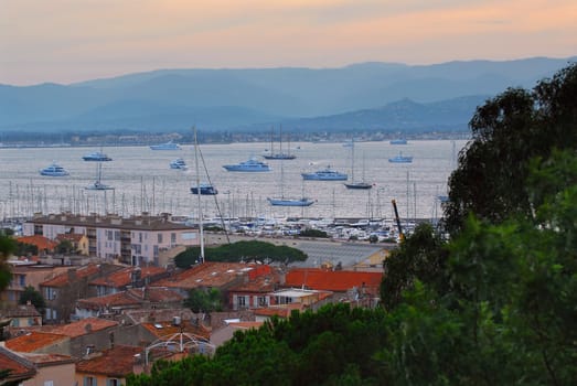 View on St. Tropez harbor in French Riviera at sunset